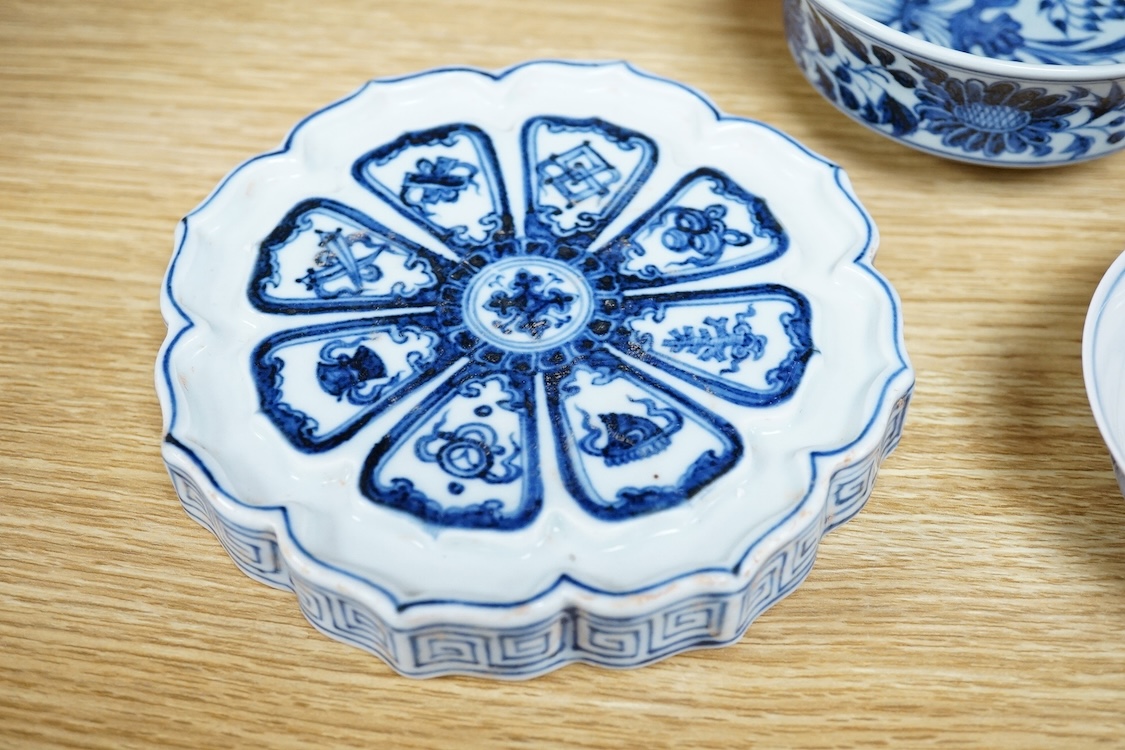 Two Chinese blue and white bowls and a lotus shaped tea pot stand, largest 15cm in diameter